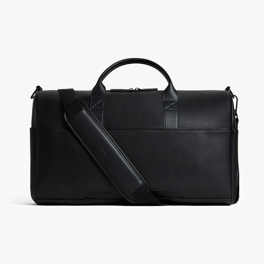 Carbon Black (Vegan Leather) | Back view of Metro Carry-All Duffel in Carbon Black