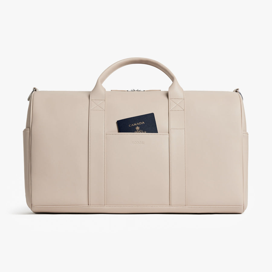 Ivory (Vegan Leather) | Front view of Metro Carry-All Duffel in Ivory