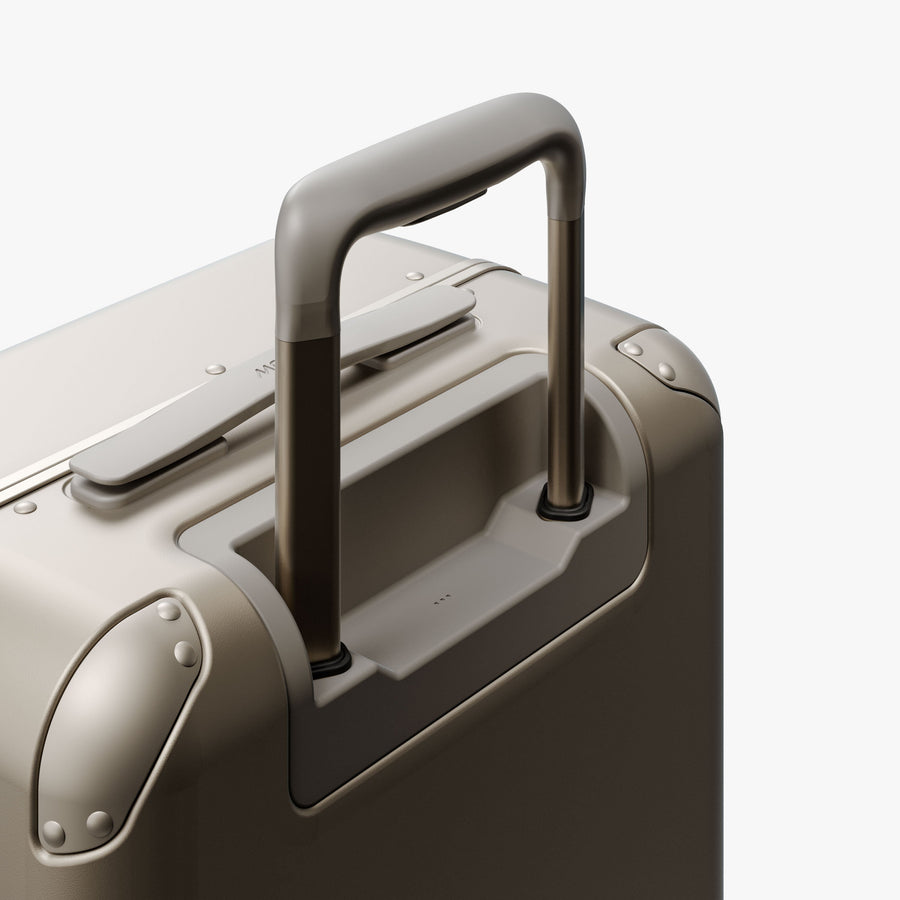 Champagne | Extended luggage handle view of Hybrid Carry-On Plus in Champagne