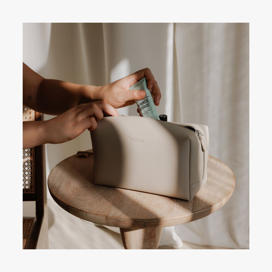 Metro Toiletry Case | Lifestyle image showing the Metro Toiletry Case Large in Ivory