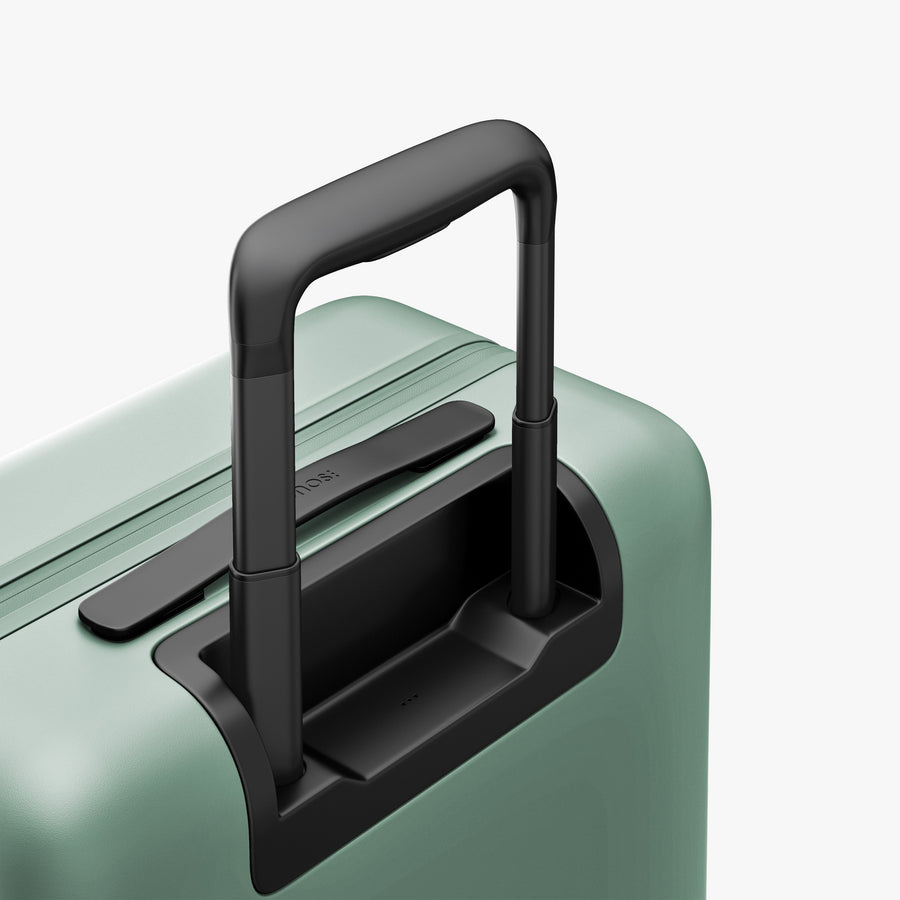 Sage Green | Extended luggage handle view of Carry-On Pro in Sage Green