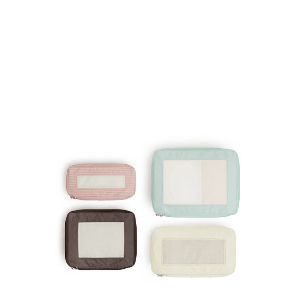 Set of Four / Multi Scaled | Set of four top view of Monos x Reformation compressible packing cubes in Multi colors
