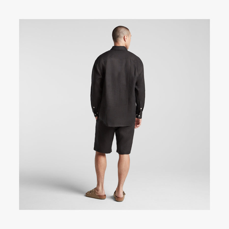 Black | Full body back view of man in Algarve Shirt in Black