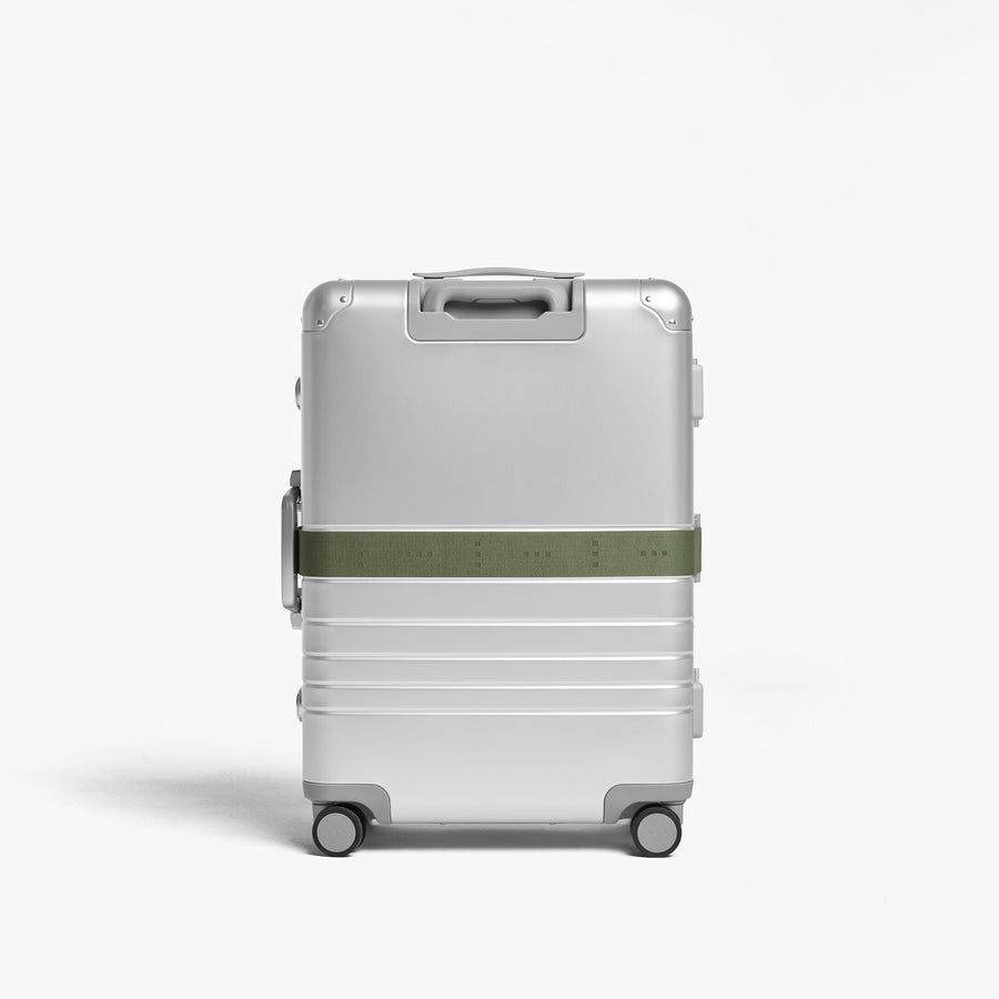Olive Green | Back view of Aluminum suitcase with the Olive Green Luggage Strap secured around it