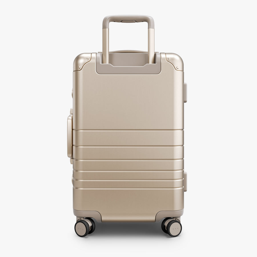 Champagne Gold | Back view of Aluminum Carry-On Plus in Champagne Gold