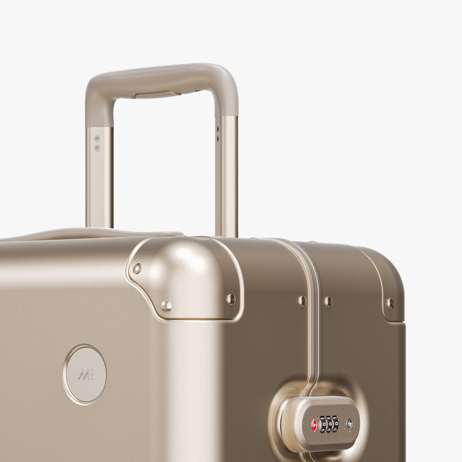 Champagne Gold | Luggage handle view of Aluminum Check-In Large in Champagne Gold