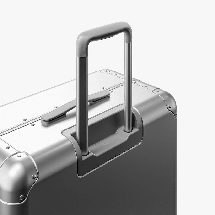 Aspen Silver | Extended luggage handle view of Aluminum Check-In Large in Aspen Silver