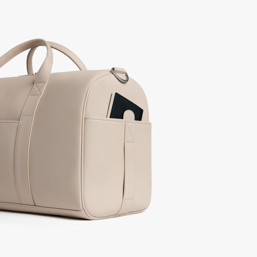 Ivory (Vegan Leather) | Angled view of Metro Carry-All Duffel in Ivory