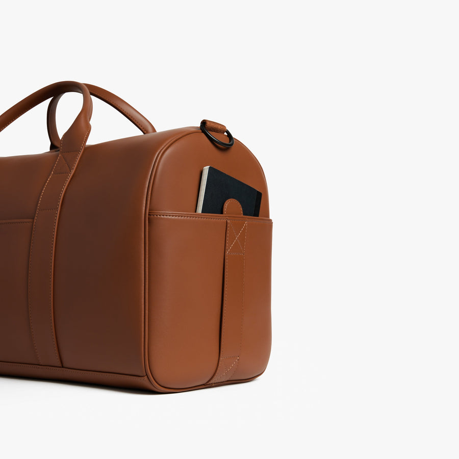 Mahogany (Vegan Leather) | Angled view of Metro Carry-All Duffel in Mahogany
