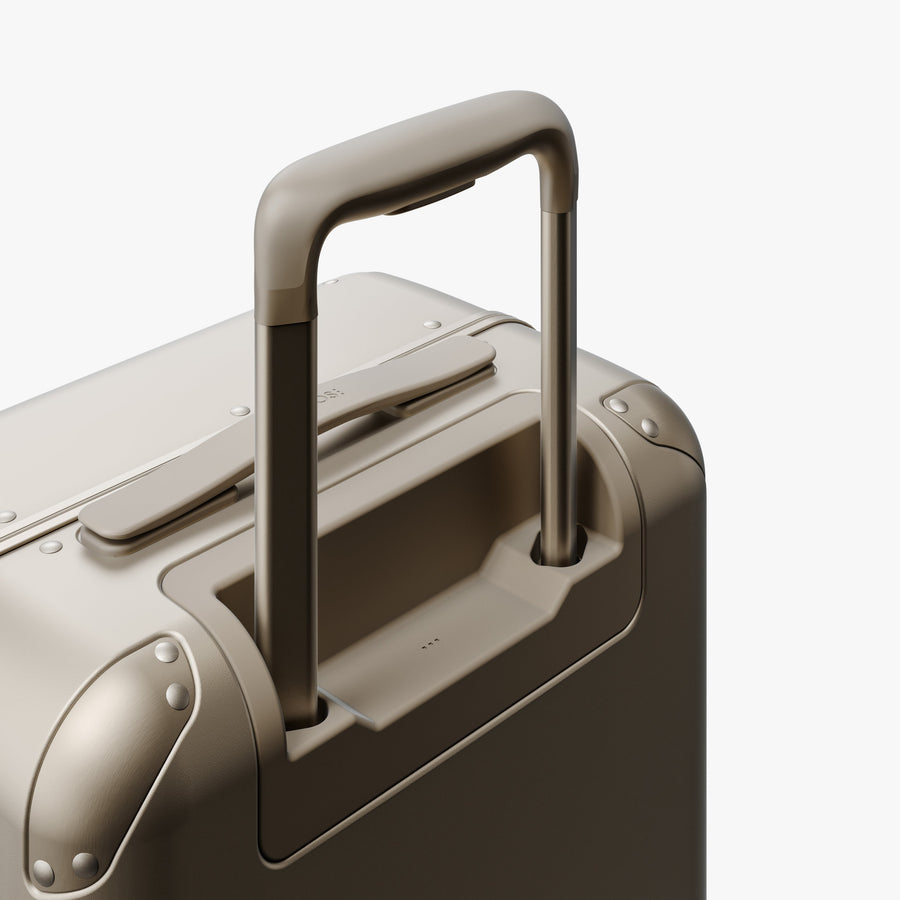 Champagne | Extended luggage handle view of Hybrid Carry-On in Champagne