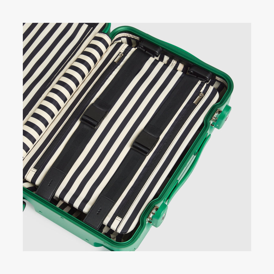 Jungle Green | Interior view of a Hybrid suitcase in Jungle Green featuring the Poplin Stripe Jungle Green compression pad with adjustable straps