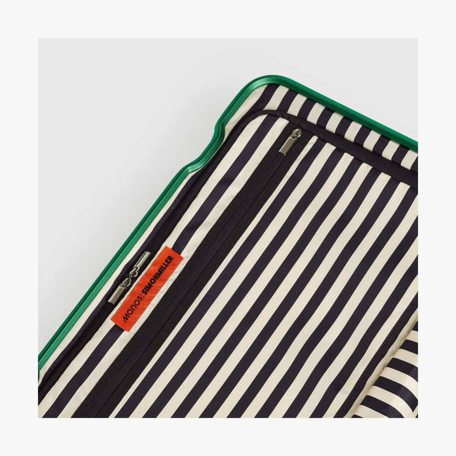 Jungle Green | Close-up view of the Hybrid suitcase interior in Jungle Green, featuring the Poplin Stripe Jungle Green zipped compartment