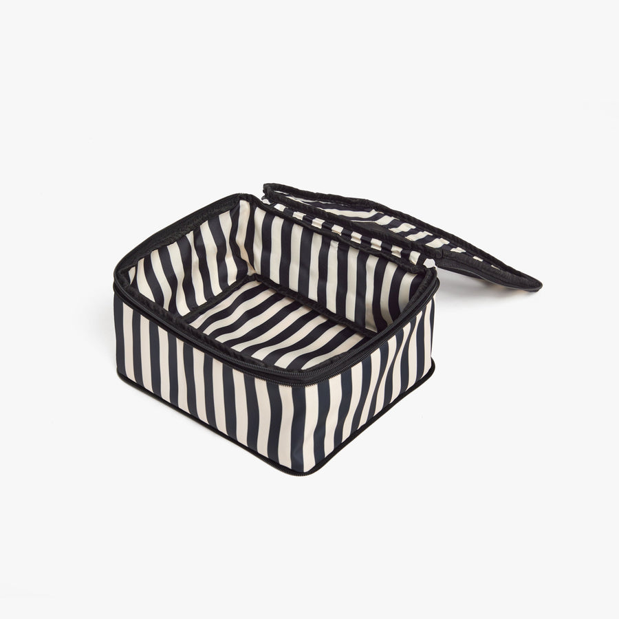 Set of Four / Poplin Stripe Black | Open Poplin Stripe Black compressible packing cube showing its spacious interior and structured shape