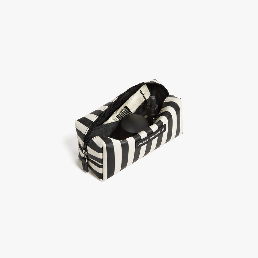 Small / Poplin Stripe Black | Front angled view of the opened small Metro Toiletry Case in Poplin Stripe Black, showing travel essentials stored inside