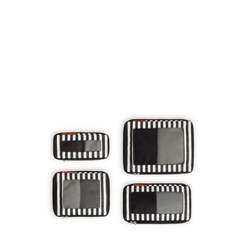 Set of four Poplin Stripe Black compressible packing cubes arranged flat to show all sizes