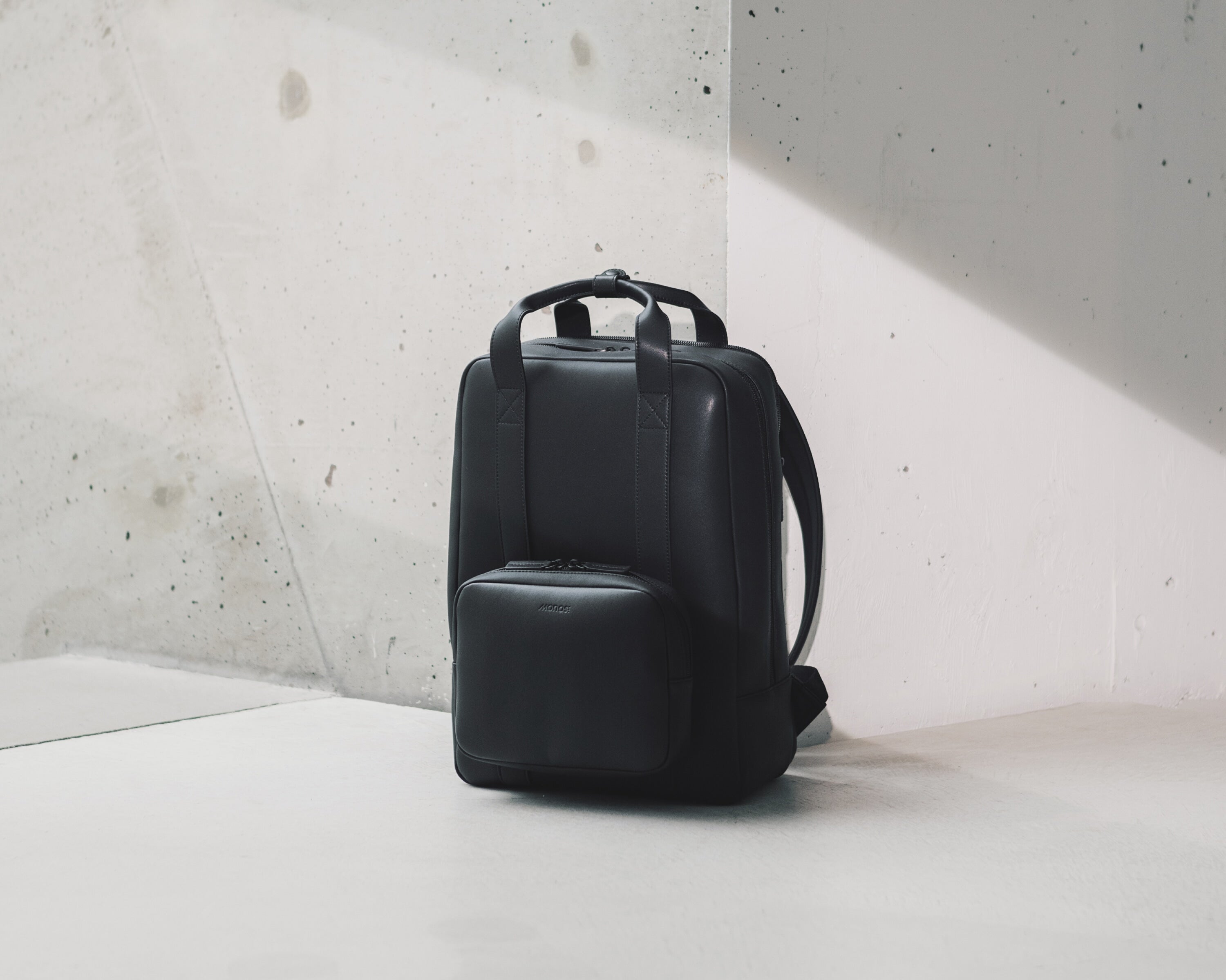 Metro Backpack – Carbon Black, Vegan Leather | Monos Travel 