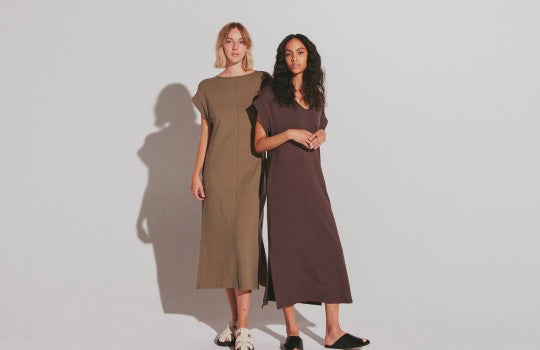 Two women stand side by side wearing Sevilla Dress in Moss and Espresso.