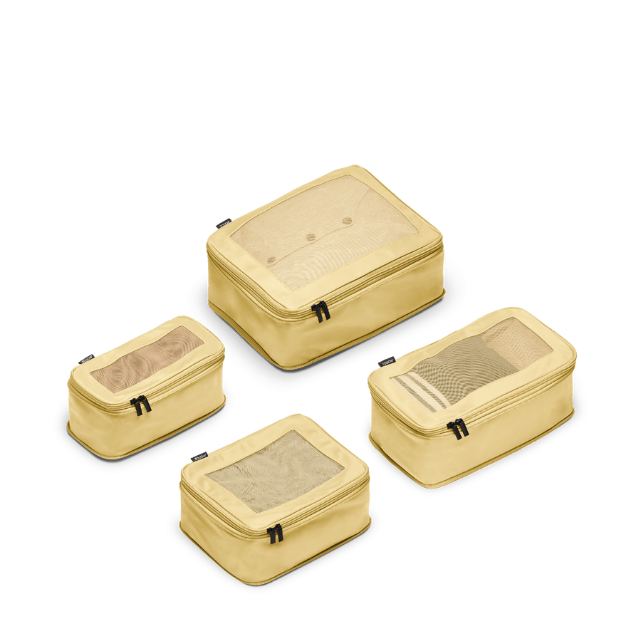 Set of Four / Banana Pudding Scaled | This is a photo of a set of four compressible packing cubes in Banana Pudding