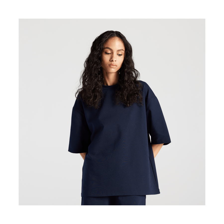 Navy Scaled | Front view of woman in Kyoto Short Sleeve in Navy