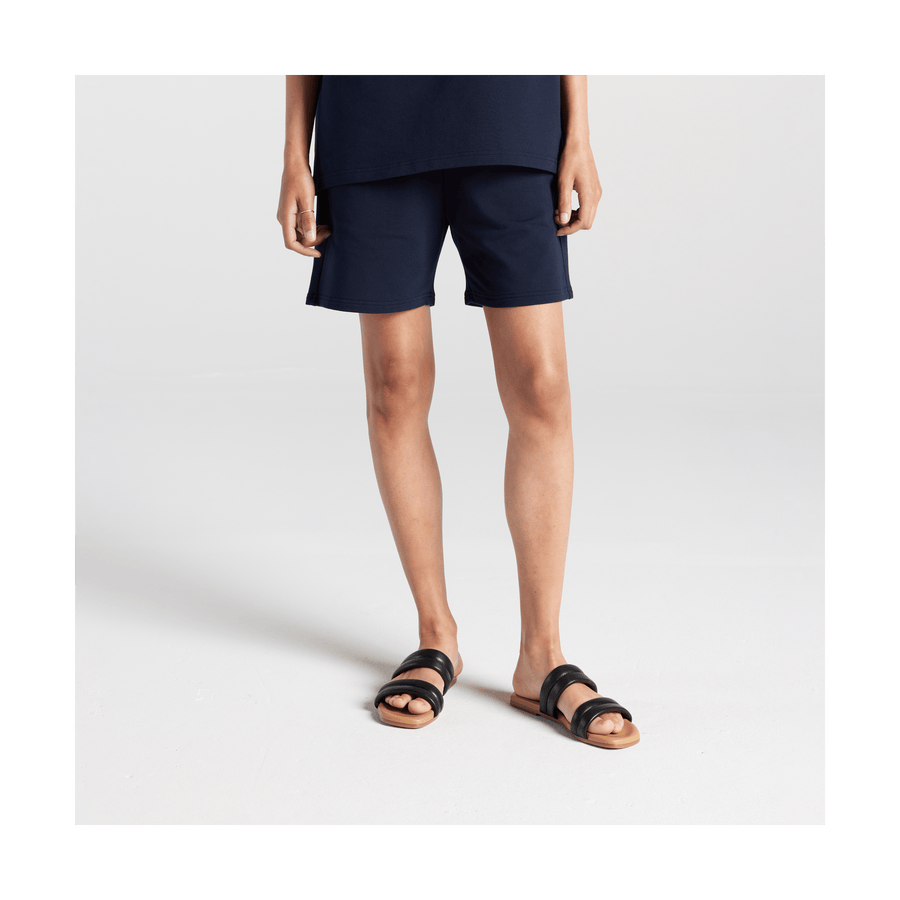 Navy Scaled | Front view of woman in Kyoto Shorts in Navy