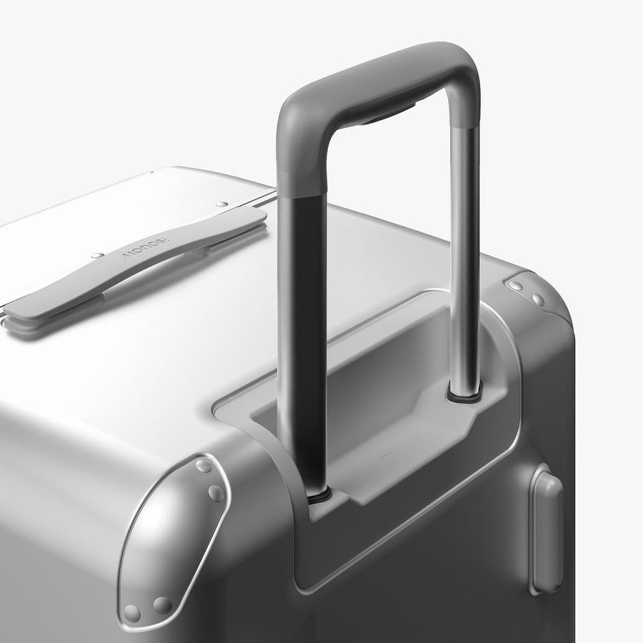 Silver | Extended luggage handle view of Hybrid Trunk in Silver