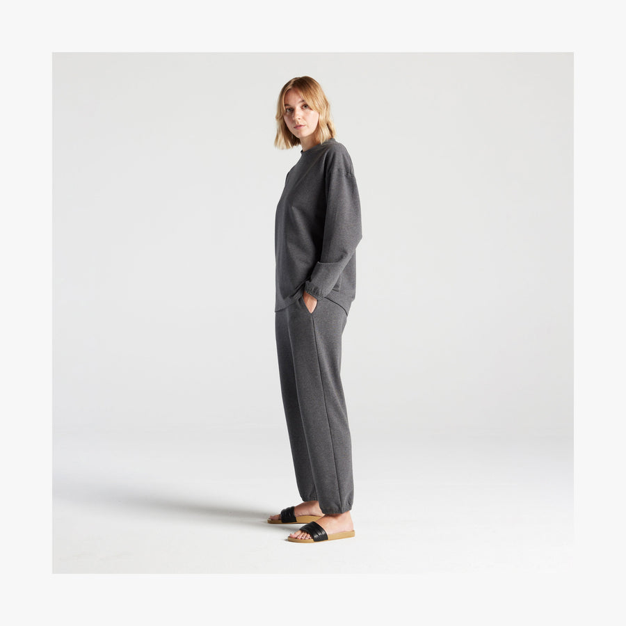 Heather Charcoal | Side full body view of female in Kyoto Long Sleeve in Heather Charcoal