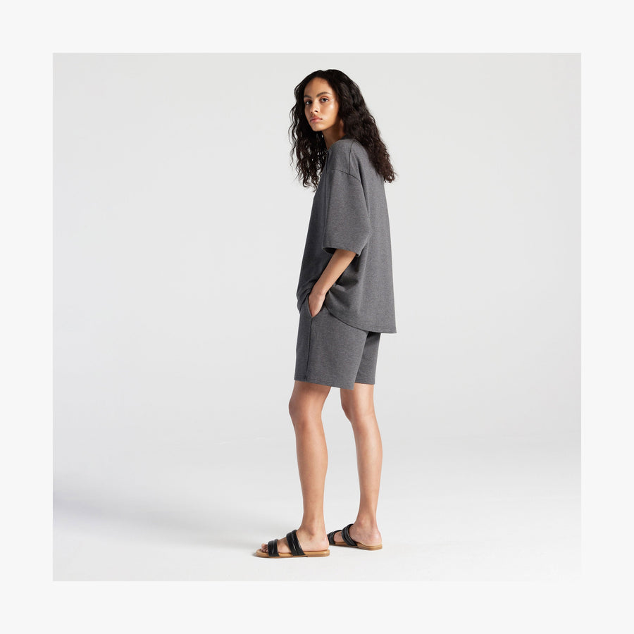 Heather Charcoal | Full body side view of woman in Kyoto Short Sleeve in Heather Charcoal