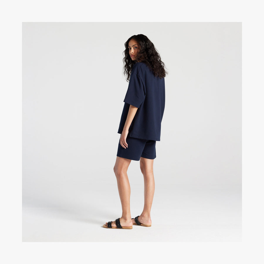 Navy | Full body back view of woman in Kyoto Short Sleeve in Navy