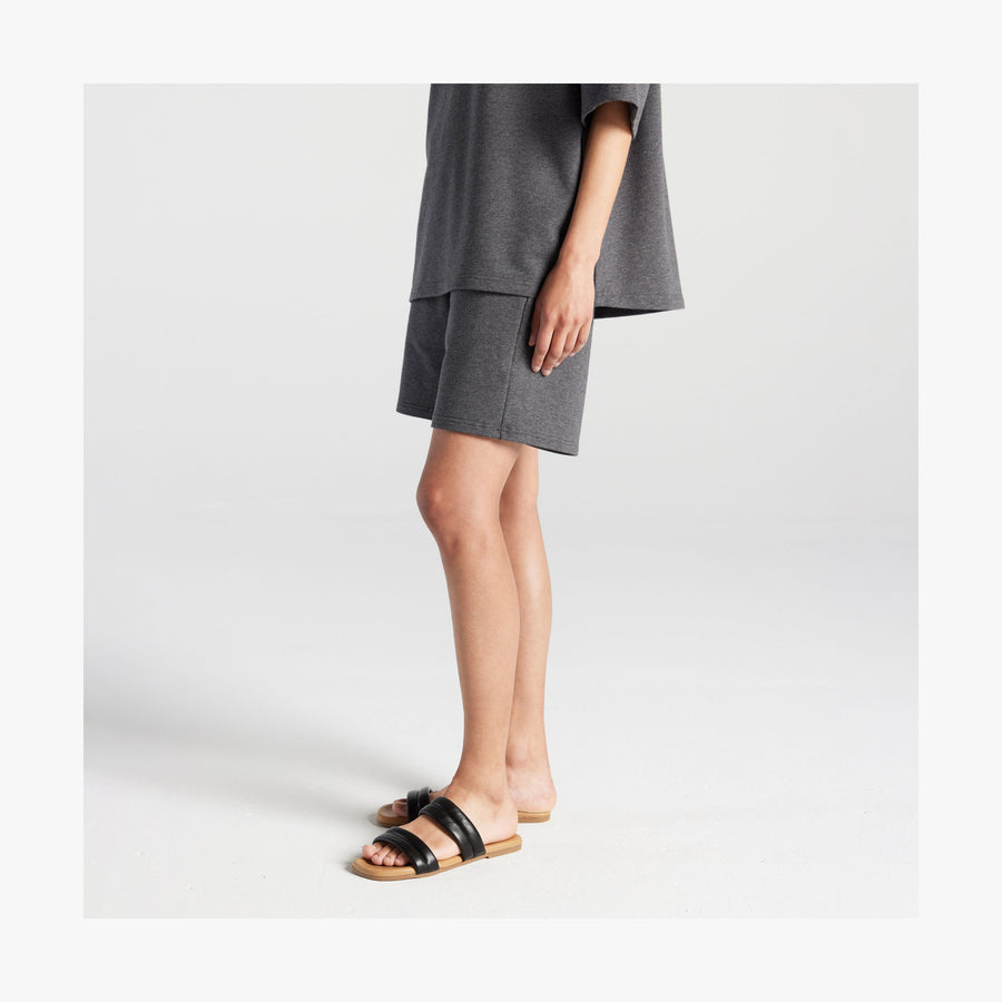 Heather Charcoal | Side pocket view of woman in Kyoto Shorts in Heather Charcoal