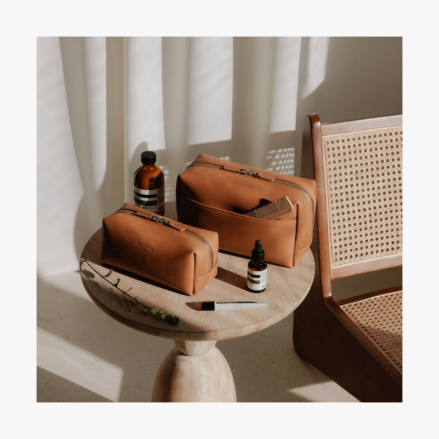 Metro Toiletry Case | Lifestyle image showing the Metro Toiletry Case Large and Small in Saddle Tan