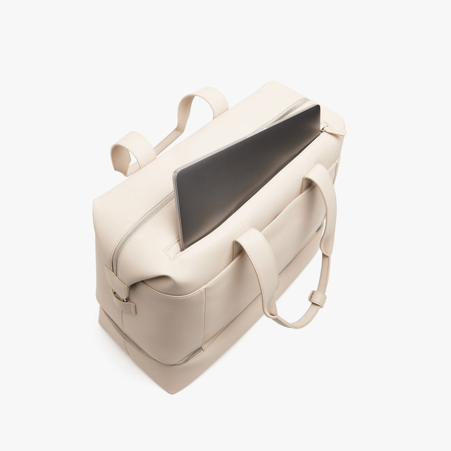 Ivory (Vegan Leather) | Laptop sleeve view of Metro Weekender in Ivory