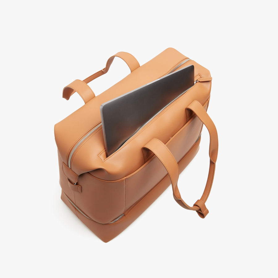 Saddle Tan (Vegan Leather) | Laptop sleeve view of Metro Weekender in Saddle Tan