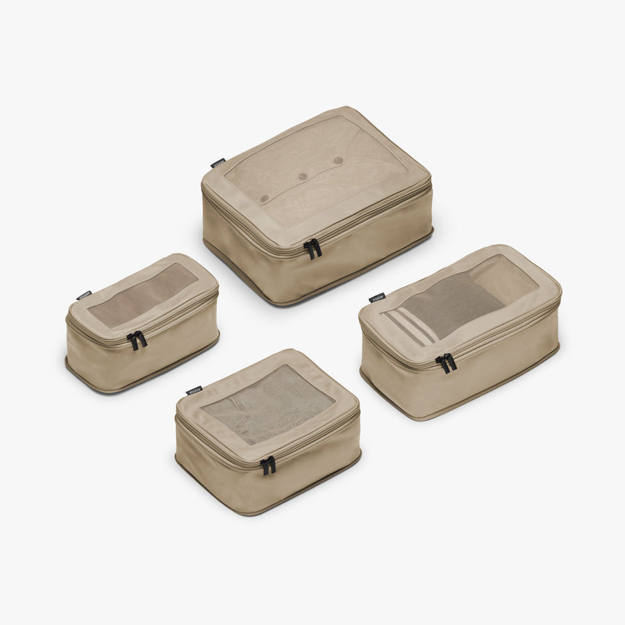 Set of Four / Tan | This is a photo of a set of four compressible packing cubes in tan