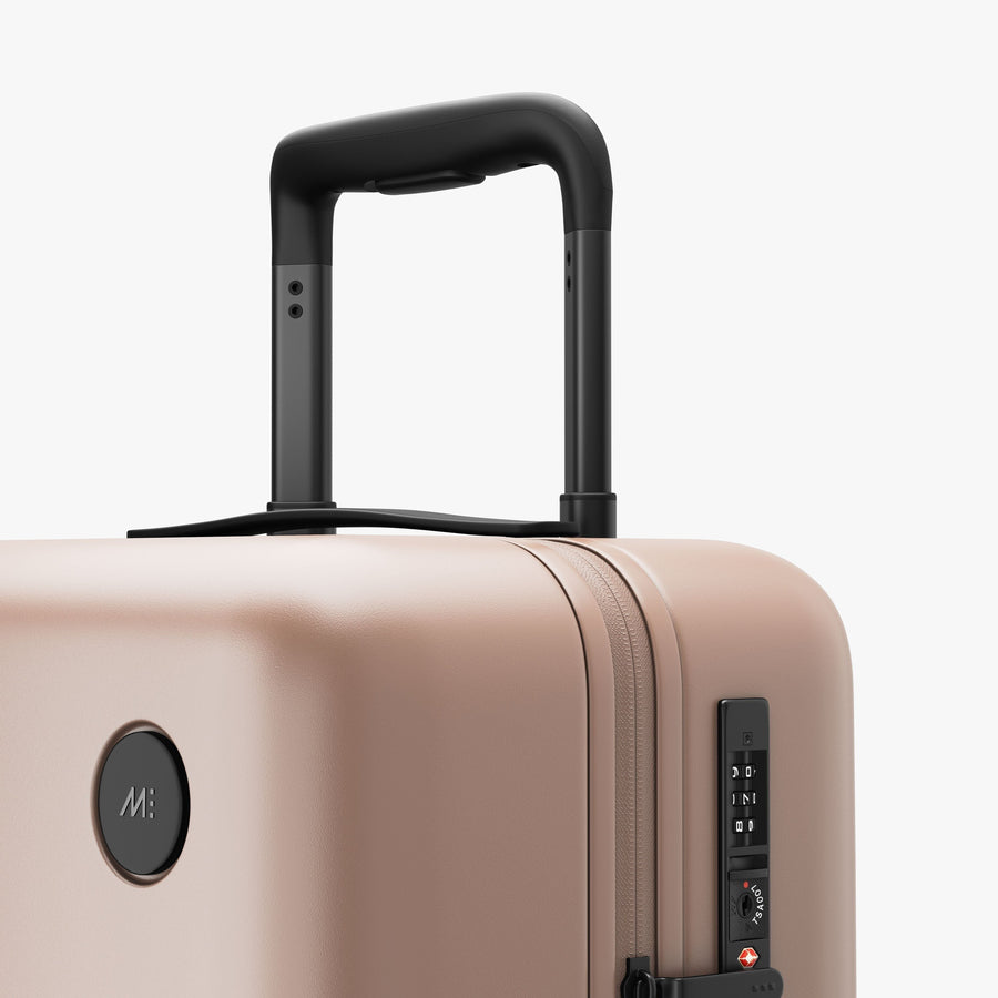 Rose Quartz | Luggage handle view of Carry-On in Rose Quartz