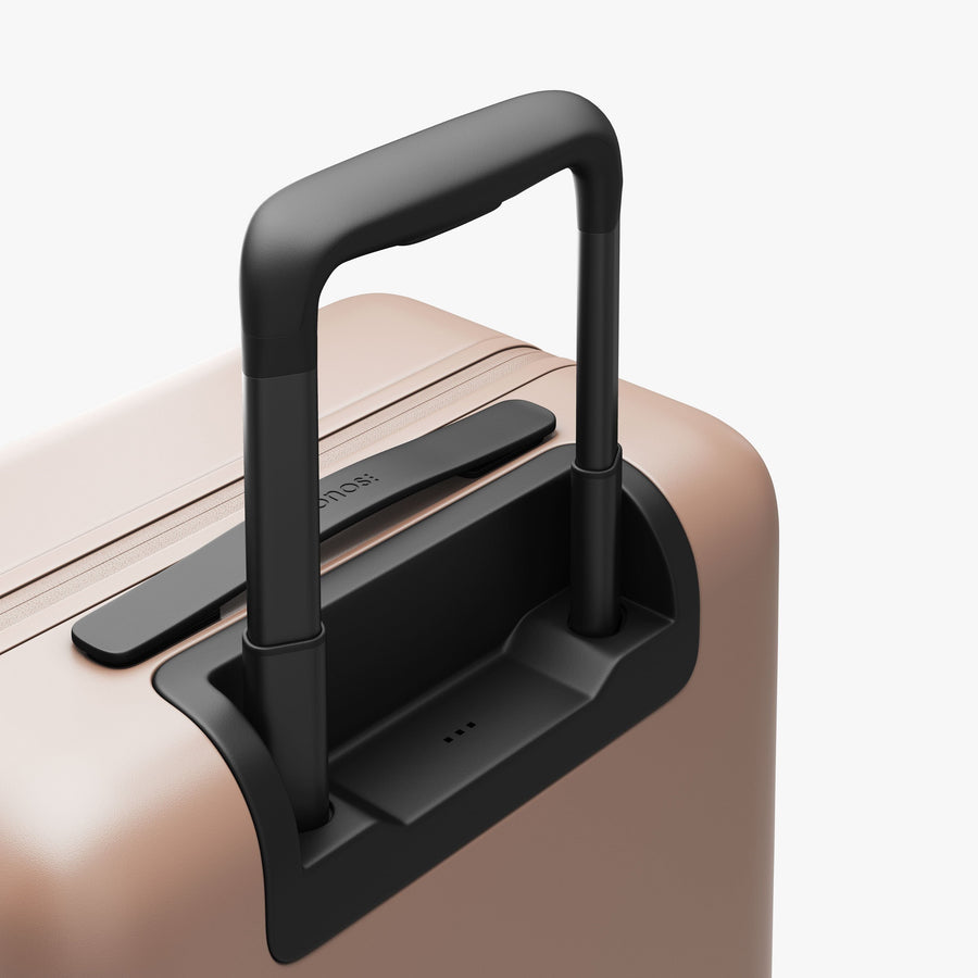 Rose Quartz | Luggage handle view of Carry-On Plus in Rose Quartz