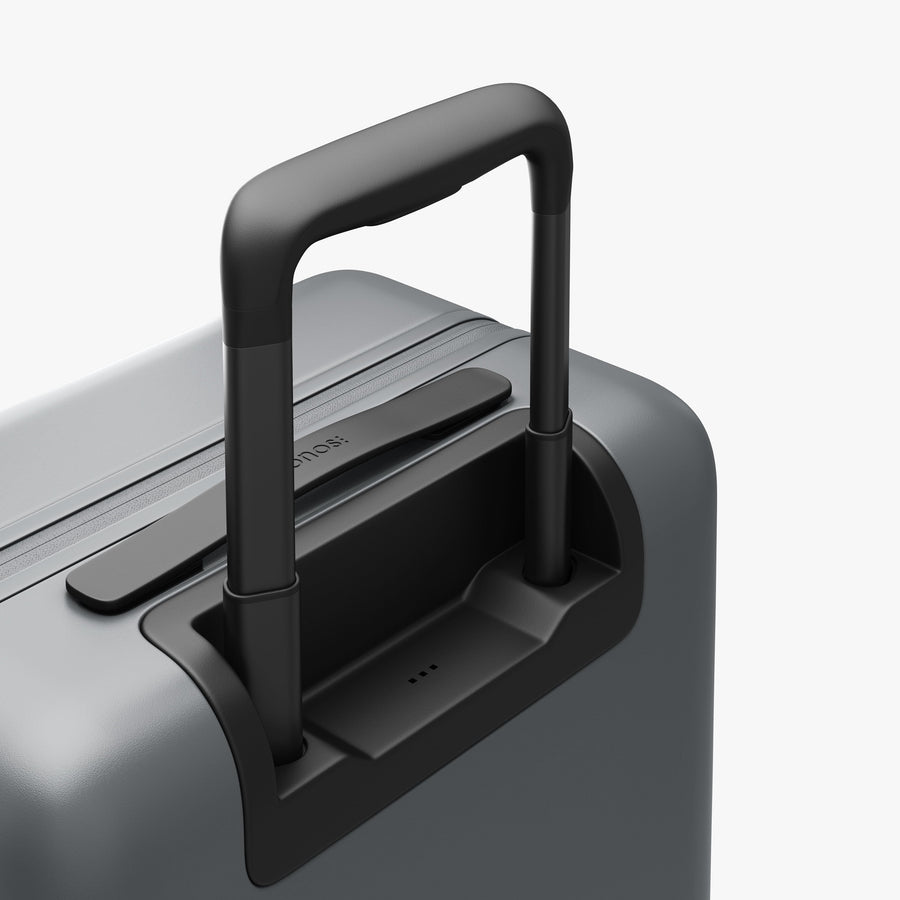 Storm Grey | Extended luggage handle view of Carry-On Plus in Storm Grey