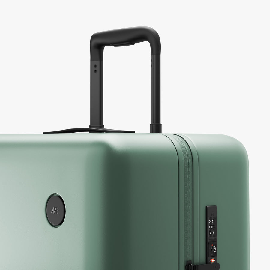 Sage Green | Luggage handle view of Check-In Large in Sage Green