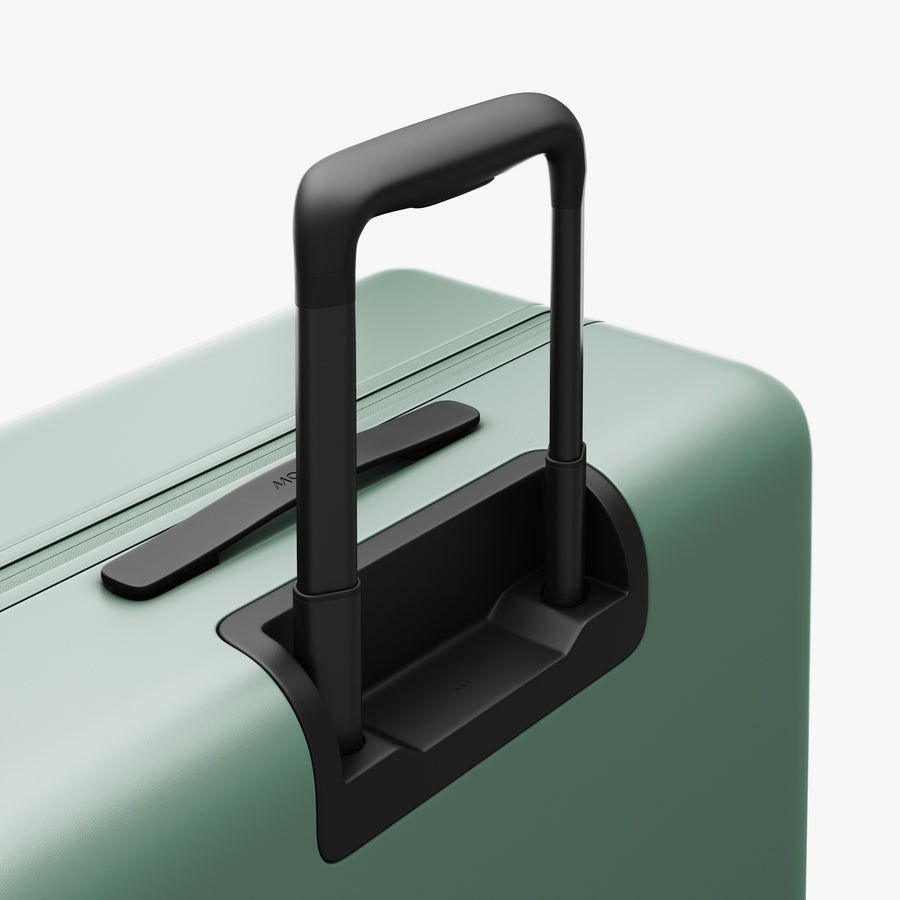 Sage Green | Extended luggage handle view of Check-In Large in Sage Green