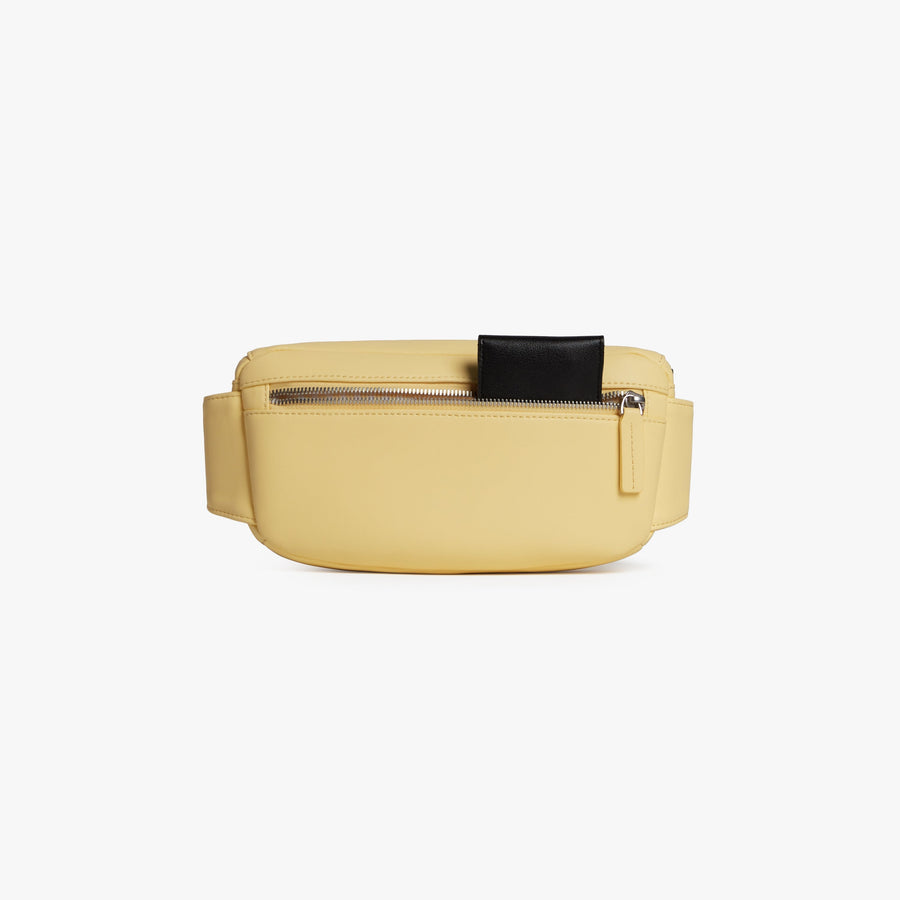 Banana Pudding (Vegan Leather) | Back pouch view of Metro Sling in Banana Pudding