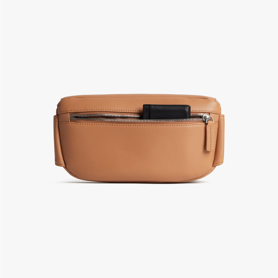 Saddle Tan (Vegan Leather) | Back pouch view of Metro Sling in Saddle Tan