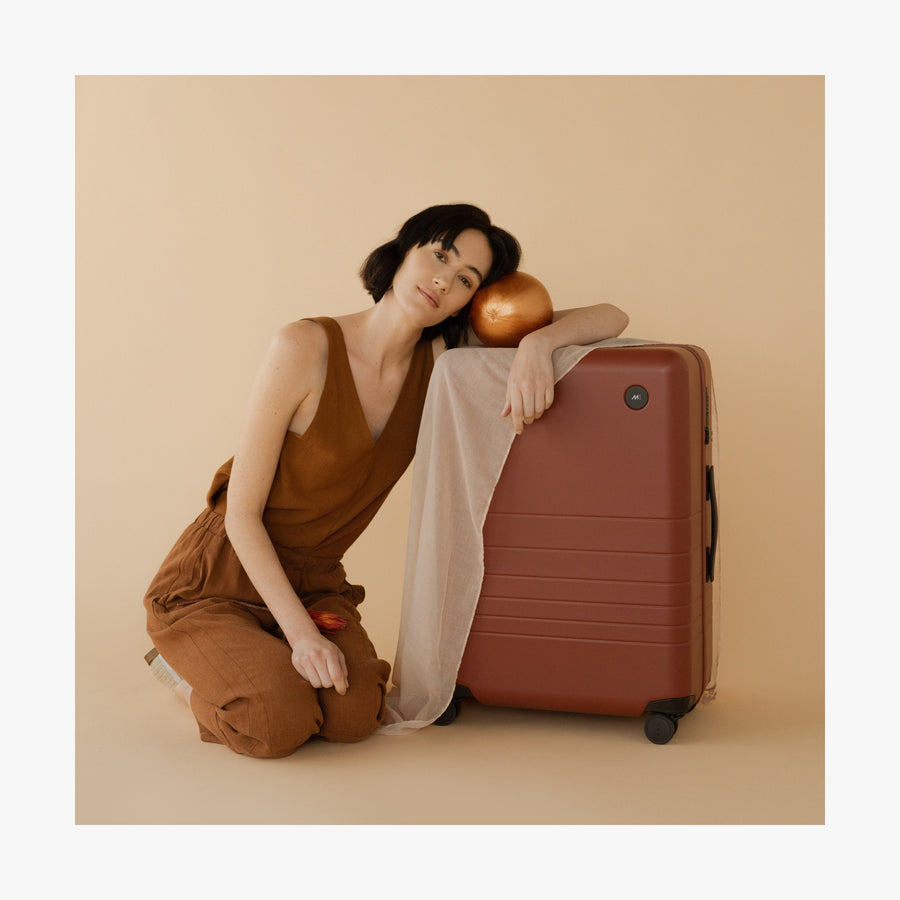 Terracotta | This is a photo of a woman with a Terracotta Carry-On