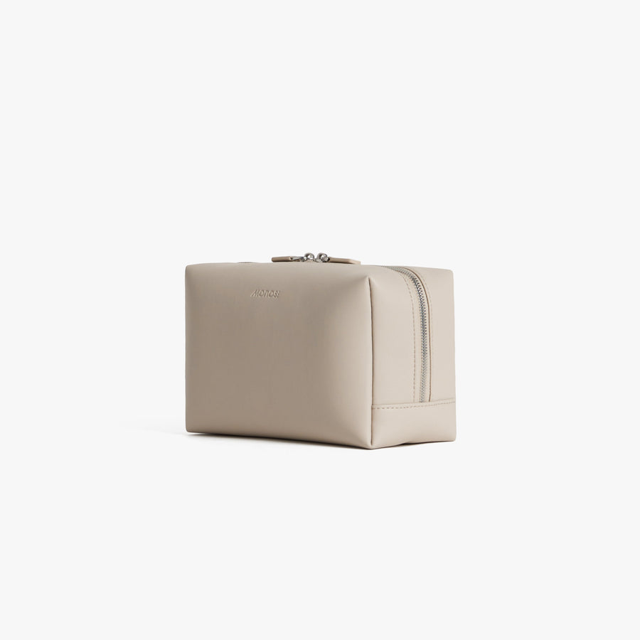 Large / Ivory (Vegan Leather) | Angled view of Metro Toiletry Case Large in Ivory
